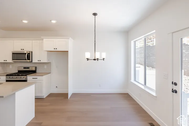 White shaker cabinetry and stainless steel appliances