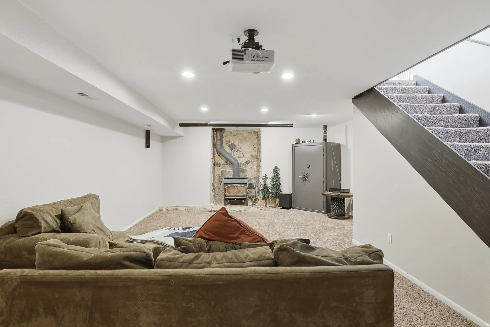 Finished basement space featuring recessed lighting and carpeted flooring