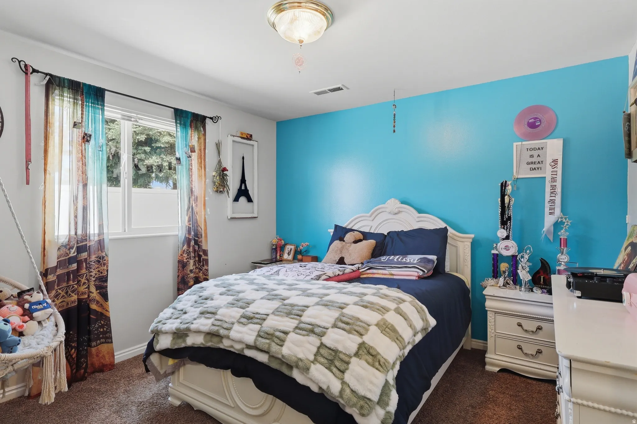 Bedroom featuring a single window, overhead flush-mount lighting, and carpet flooring