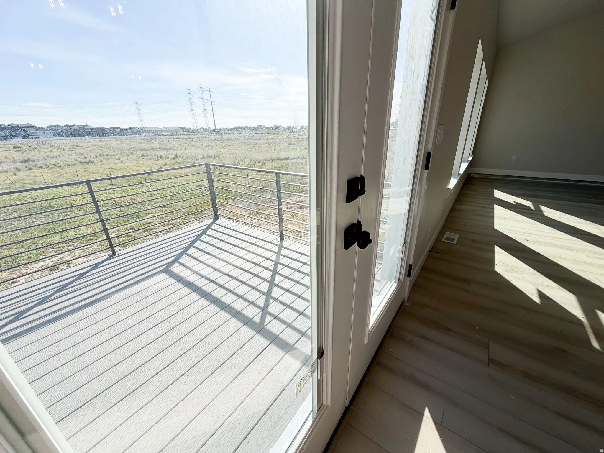 Outdoor deck featuring composite decking and metal railing