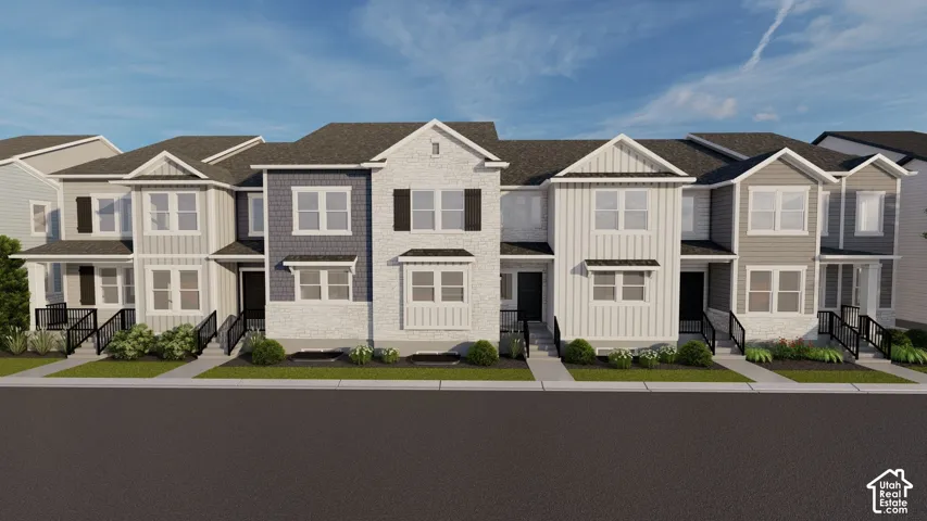 Modern townhome row featuring gabled roofs, varied siding textures, and contrasting trim