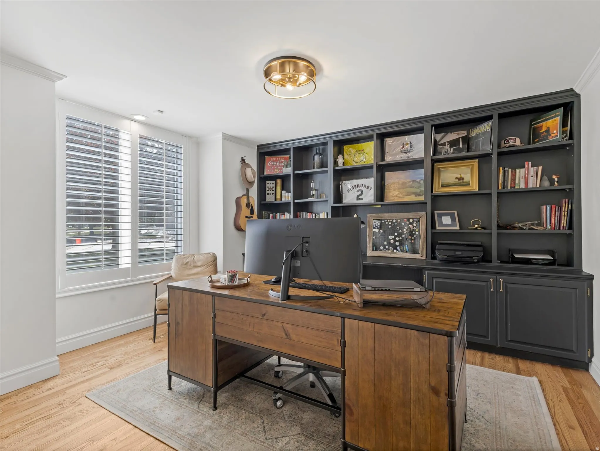 Office right off the main entry with built-in shelves