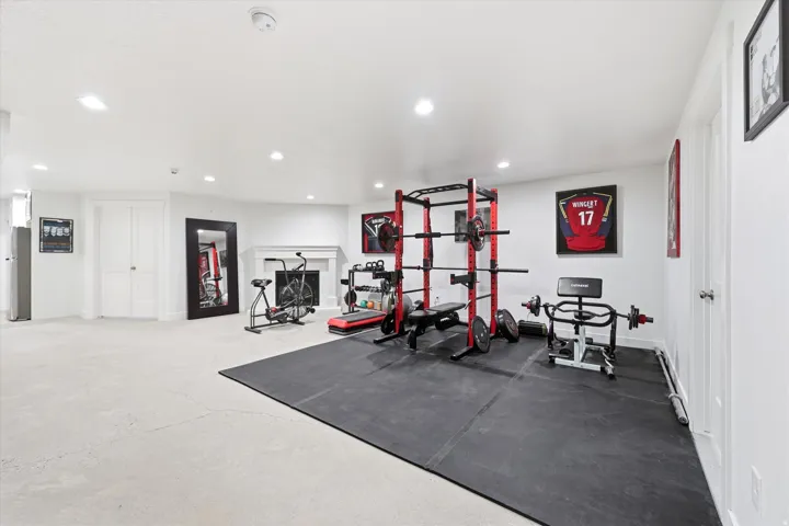 Spacious interior room with light-colored flooring and white walls