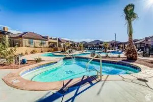 Multi-tiered swimming pool with integrated spa and deck access
