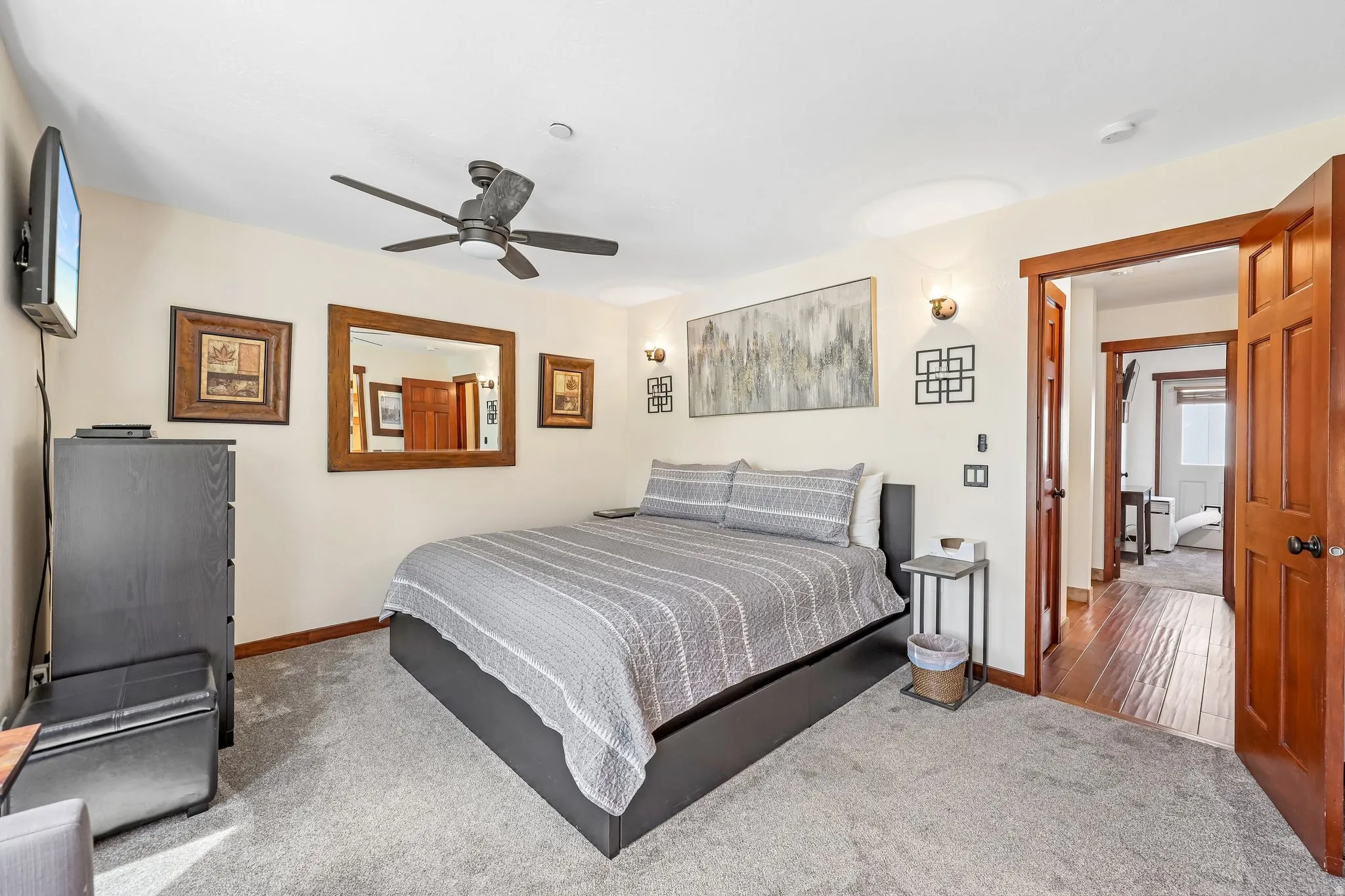 Plush carpeting enhances this room featuring a ceiling fan, recessed lighting, and wall sconces