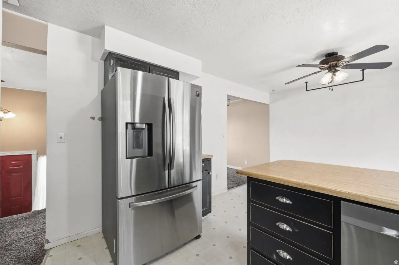Stainless steel French door refrigerator with ice and water dispenser is included and ready to go. The open layout connects the kitchen directly to the dining and living areas, making this a naturally social floor plan.