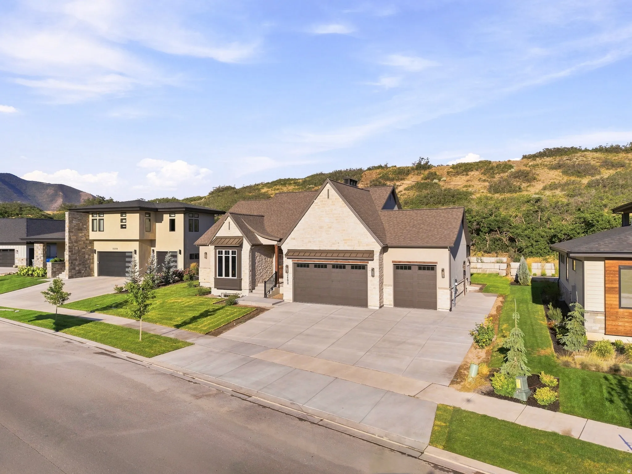 Stone and siding exterior with dark trim accents