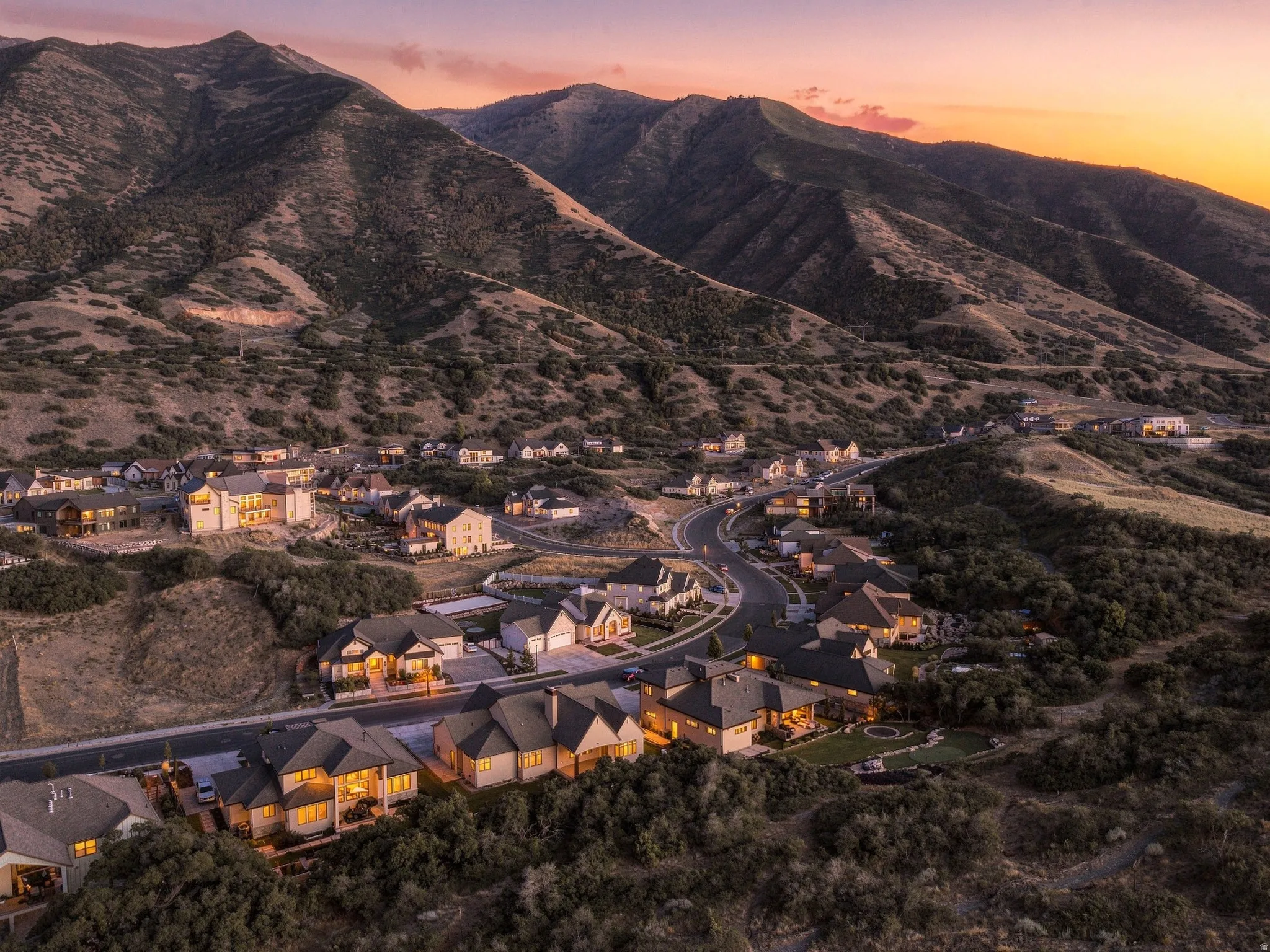 New construction residences set against a prominent mountain backdrop