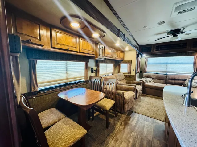 Dining area featuring a built-in booth, wood-finish table, and matching chairs