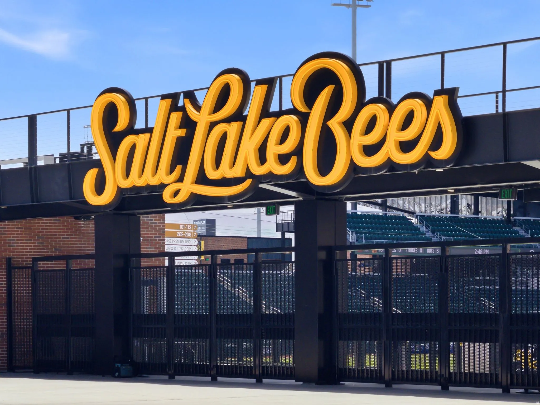 Salt Lake Bees stadium entrance featuring a prominent illuminated marquee