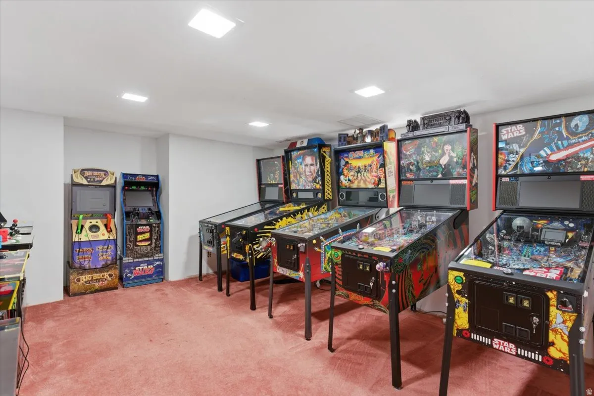 Recreational room with wall-to-wall carpeting and recessed ceiling lighting