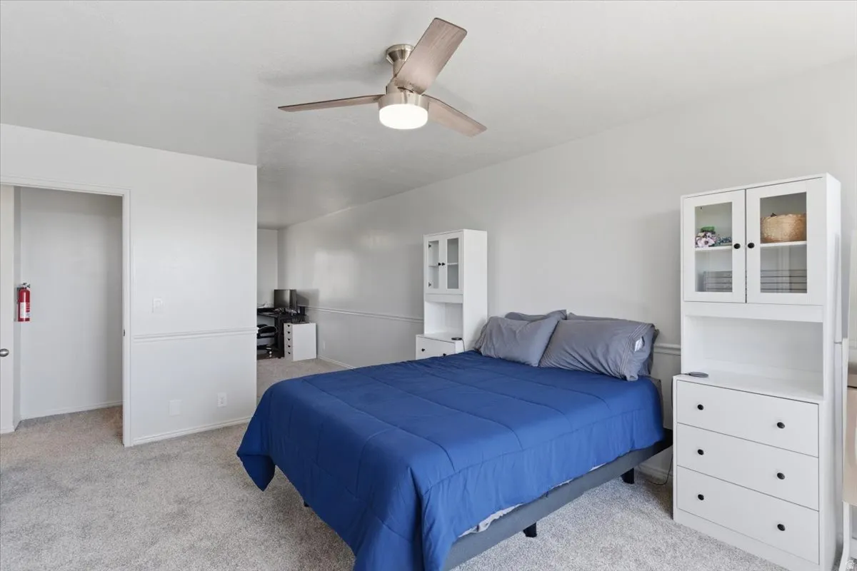 Neutral-toned carpeting paired with light-colored wall paint creates a bright interior