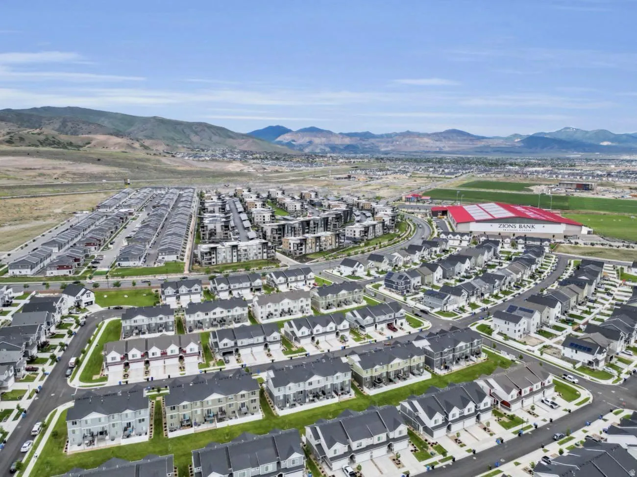 Expansive residential community featuring a variety of housing styles including multi-story townhomes and single-story residences