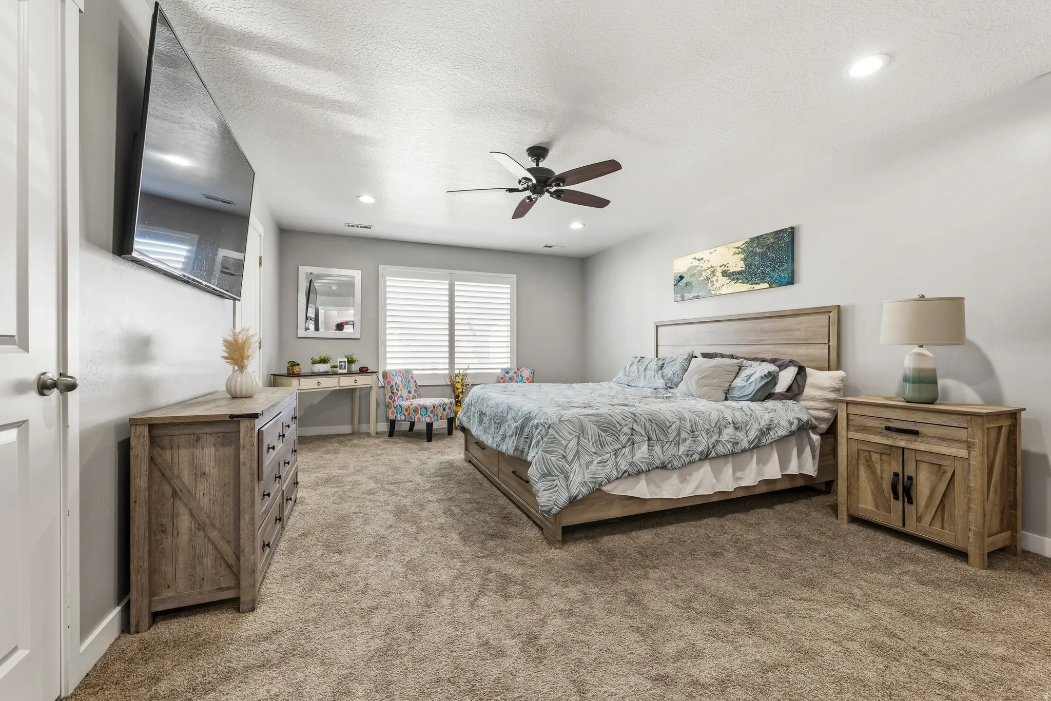 Spacious interior featuring neutral wall tones and plush carpeting