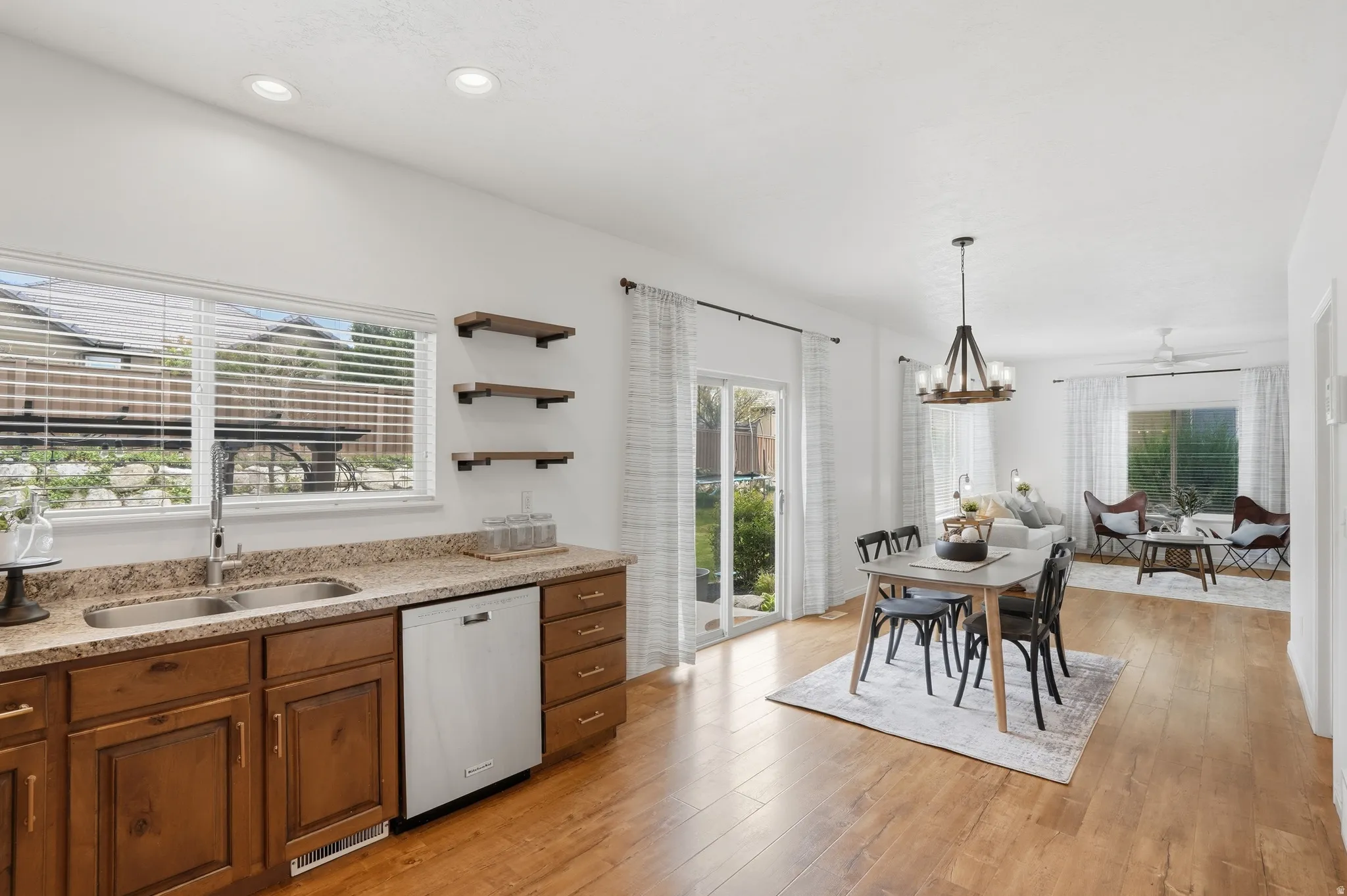 Kitchen and dining area featuring wood-finish flooring