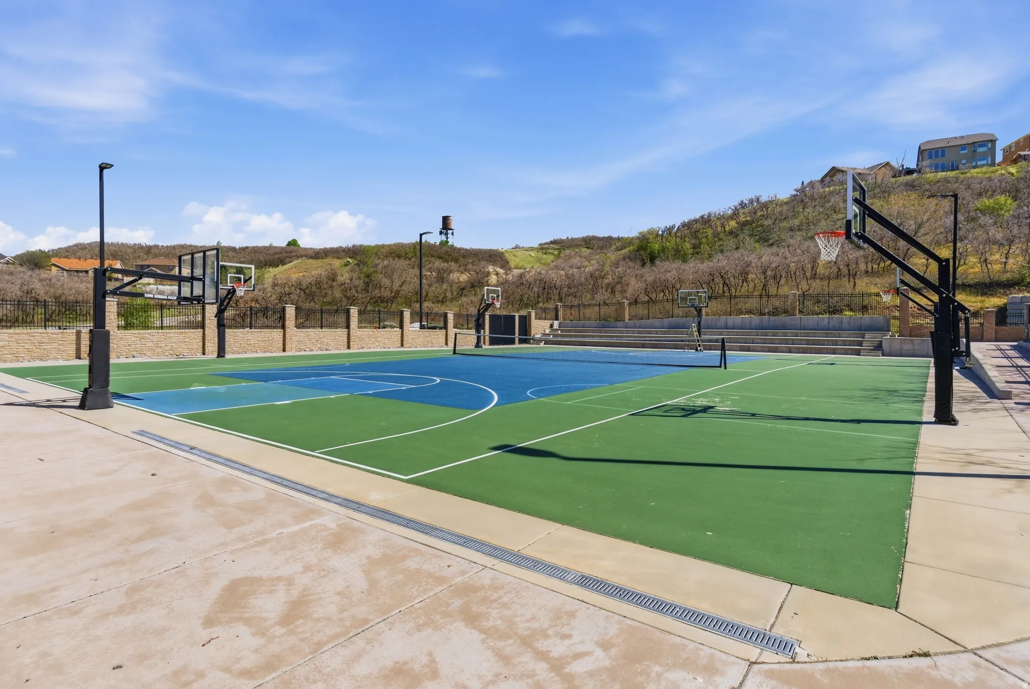 Multi-sport court featuring vibrant blue and green surfacing