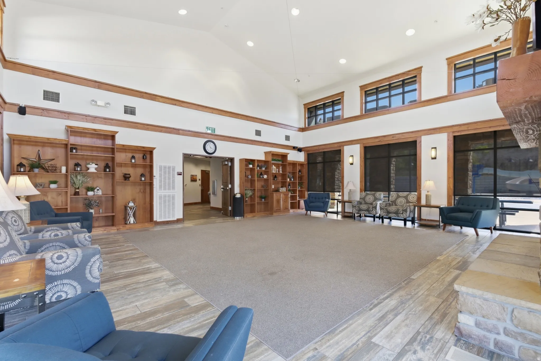 Spacious common area featuring vaulted ceilings and extensive wood-finish trim