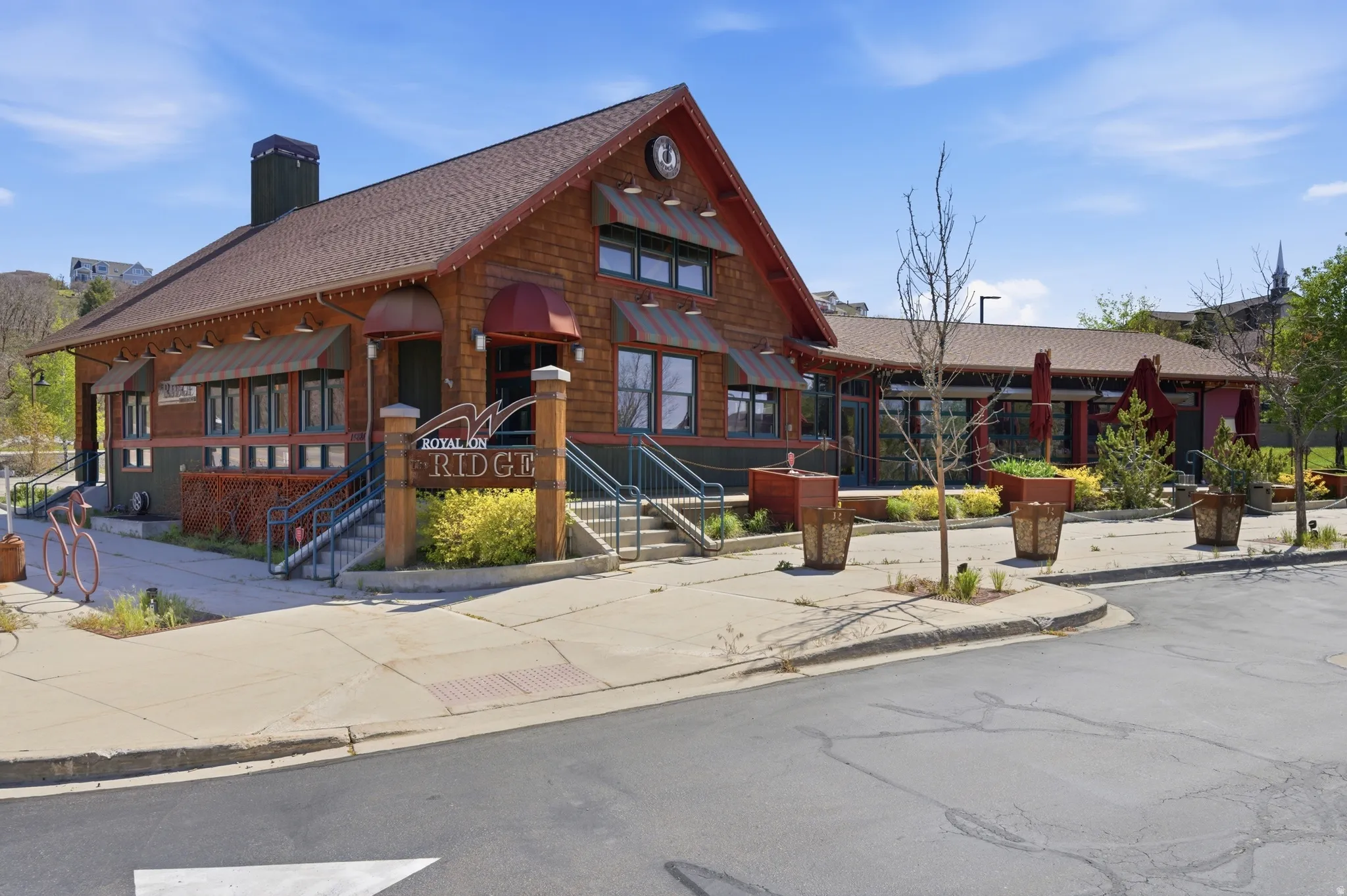Commercial property with shingle siding and a gabled roofline