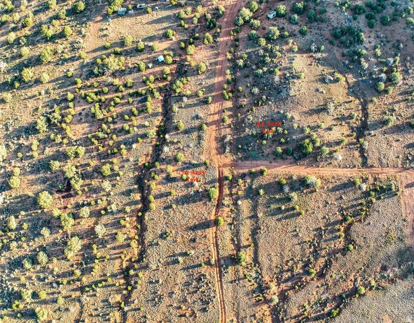 Expansive undeveloped land featuring natural terrain and sparse vegetation