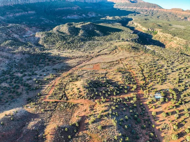Expansive desert landscape featuring natural terrain and sparse vegetation