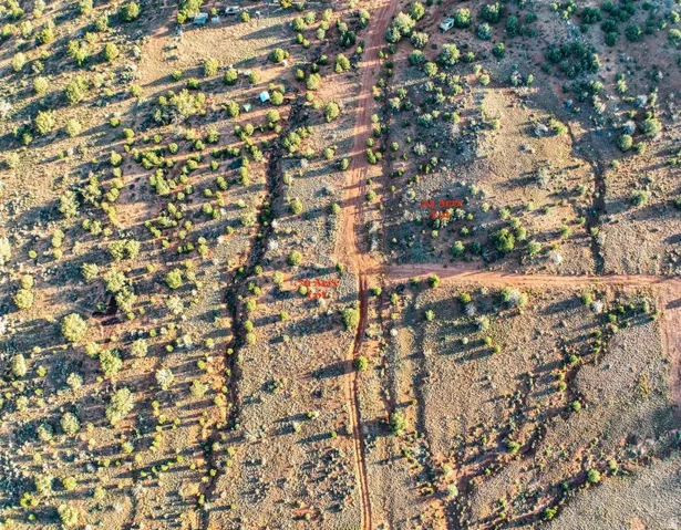 Expansive undeveloped land featuring natural terrain and sparse vegetation
