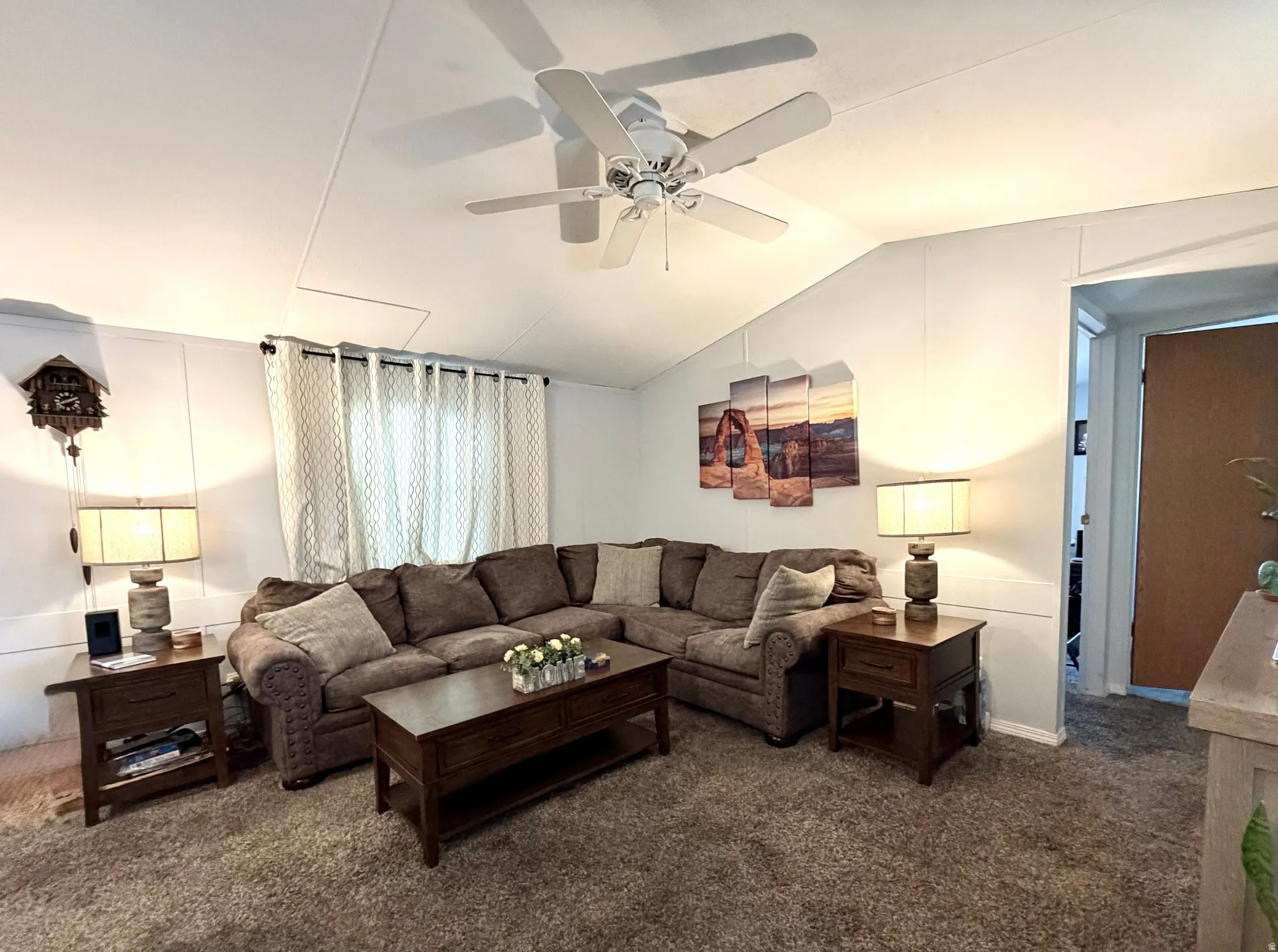 Spacious, open living area featuring vaulted ceilings