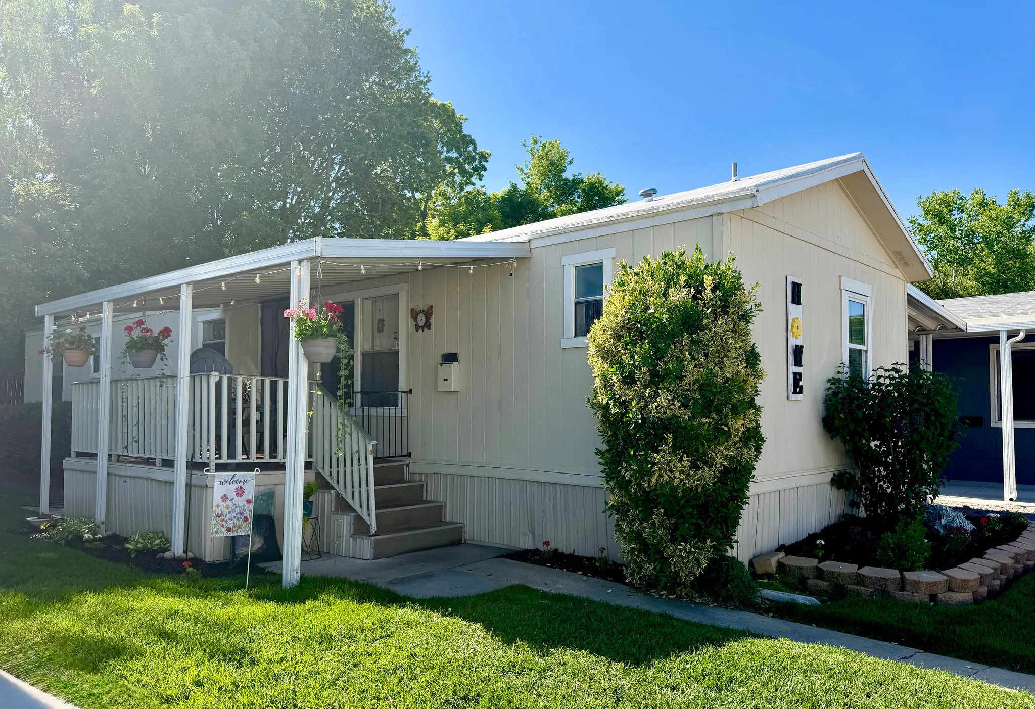 Main level living with attached carport, covered front porch, and easy to manage front yard.