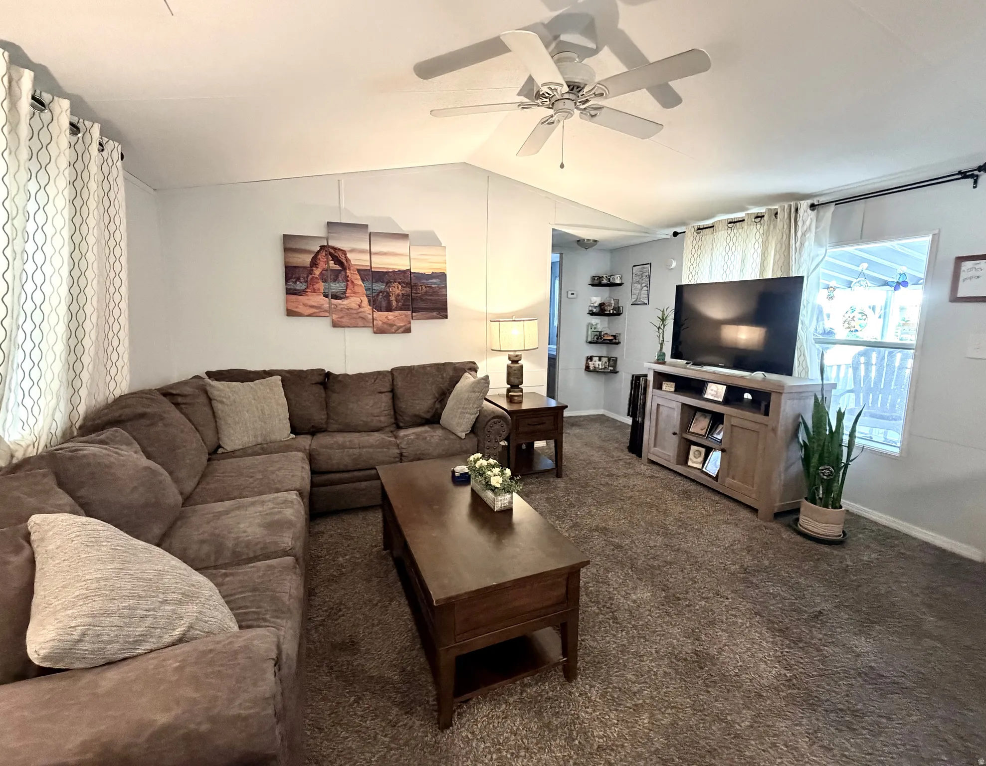 Spacious, open living area featuring vaulted ceilings