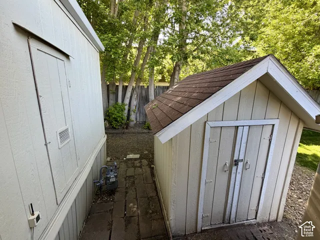 Home has 2 storage sheds at the back of the carport - by the home's side entry