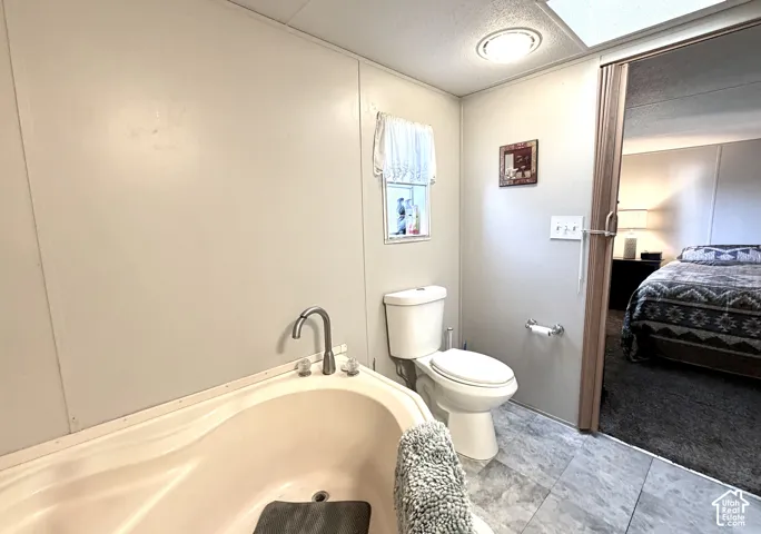 Large primary bathroom with plenty of cabinet storage, soaker tub, and separate shower
