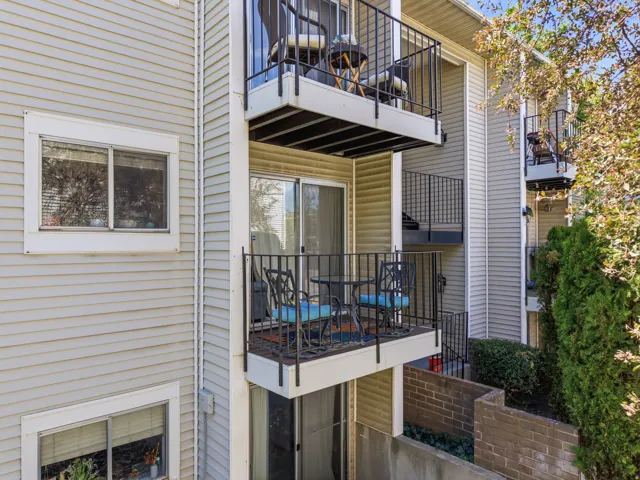 Multi-level exterior balconies with black wrought iron railings