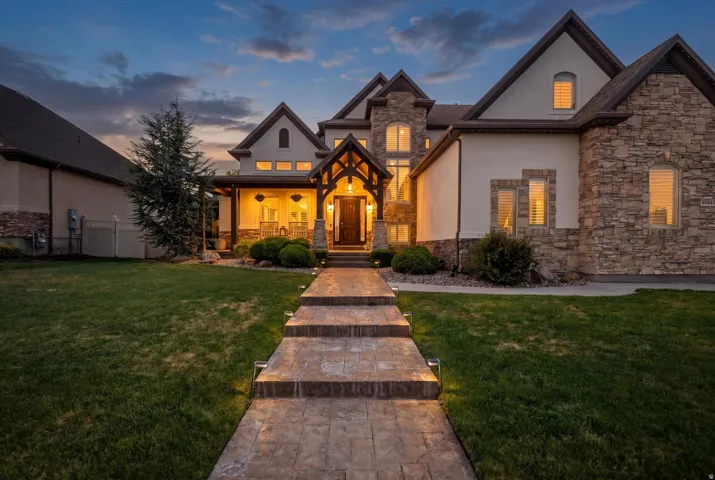 Stone and stucco exterior with multiple gables