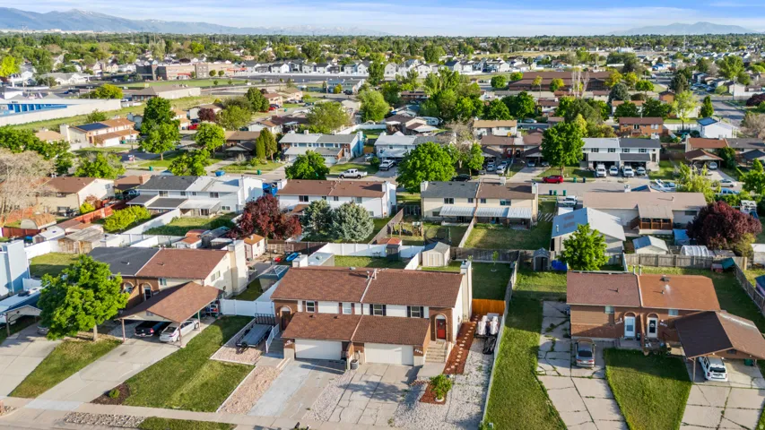 Aerial perspective showcasing a residential neighborhood with varied architectural styles and mature landscaping