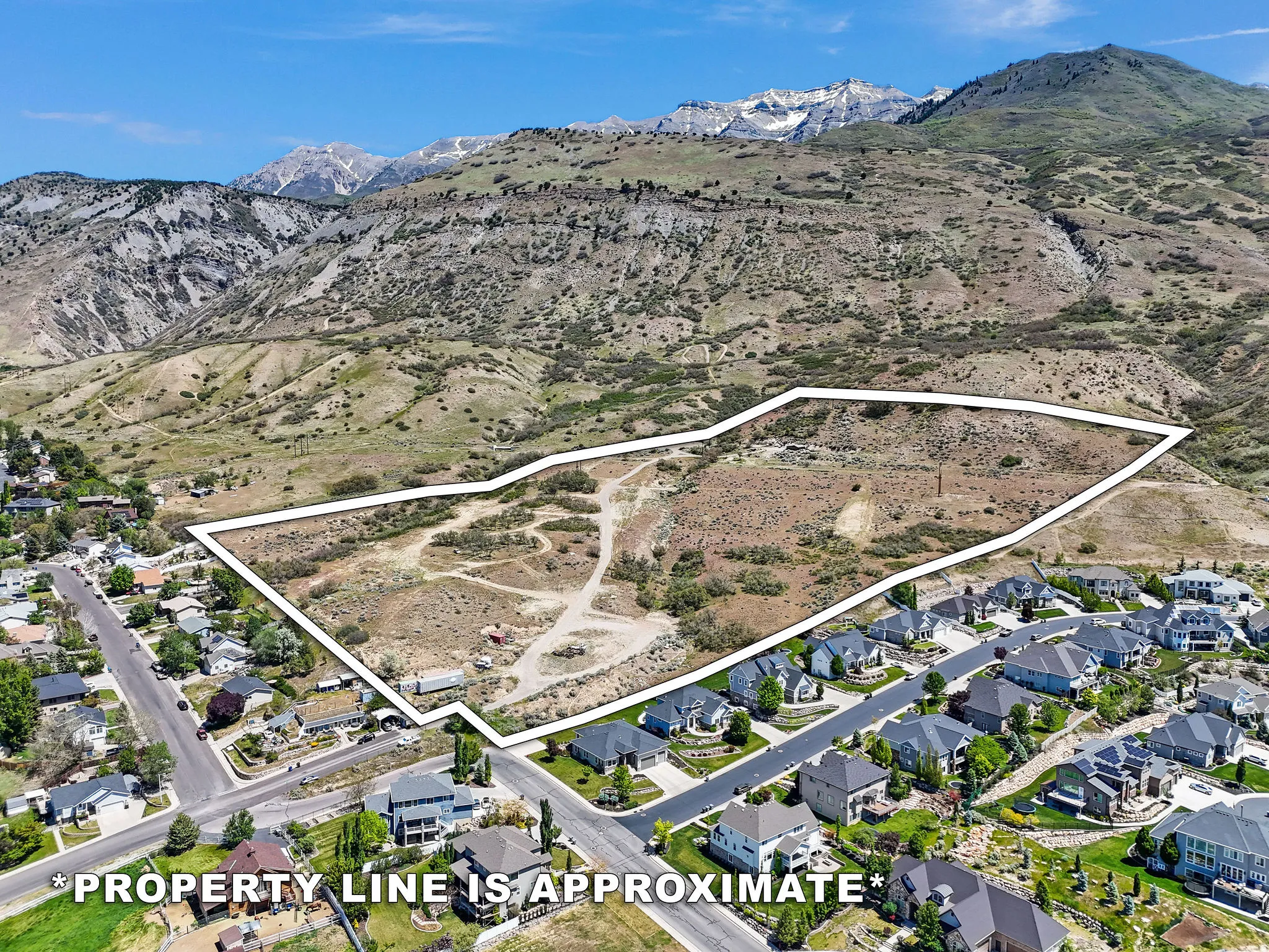 Expansive undeveloped land parcel with mountain backdrop