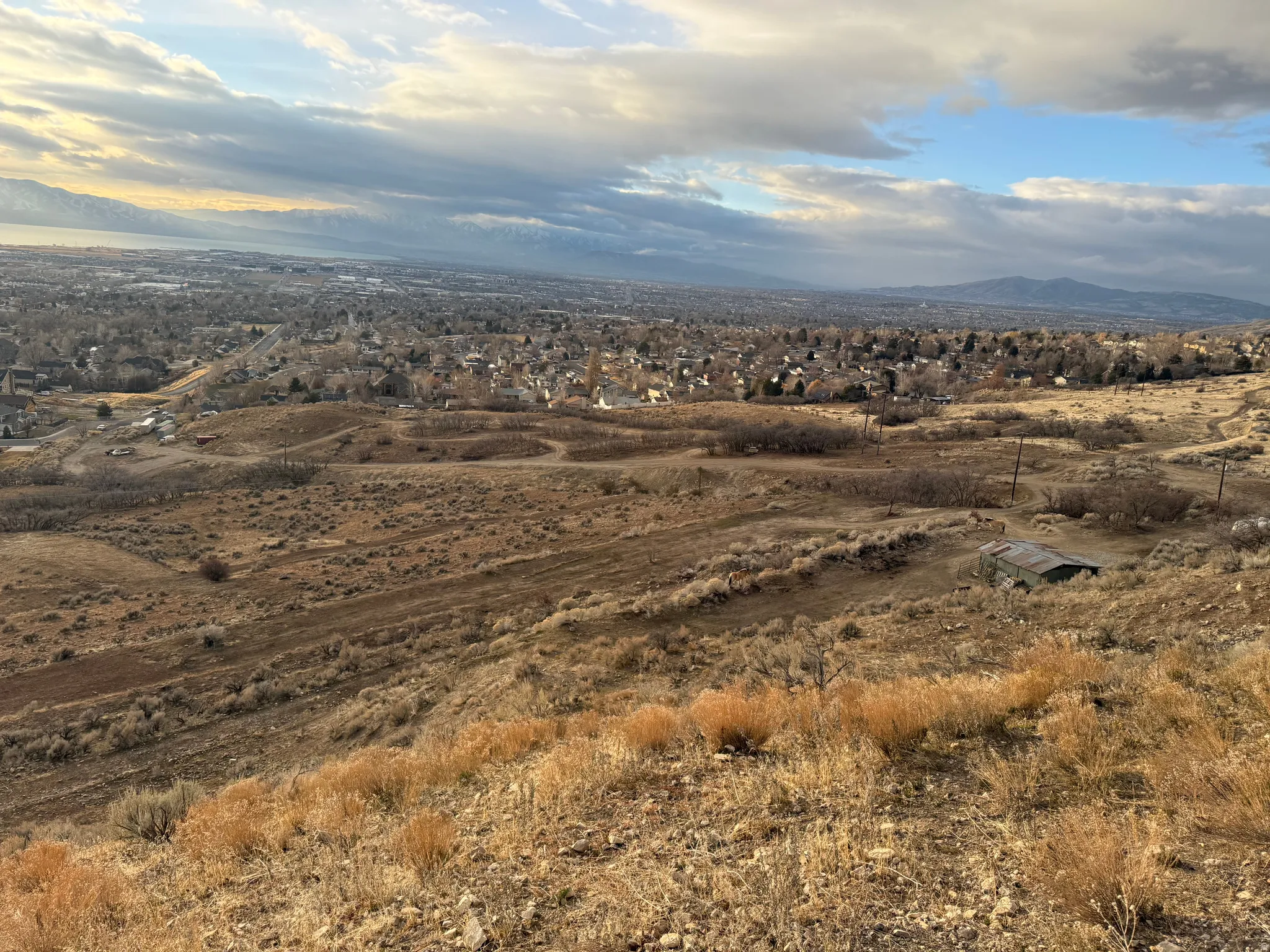 Expansive elevated terrain offering broad scenery of the distant cityscape and mountain ranges