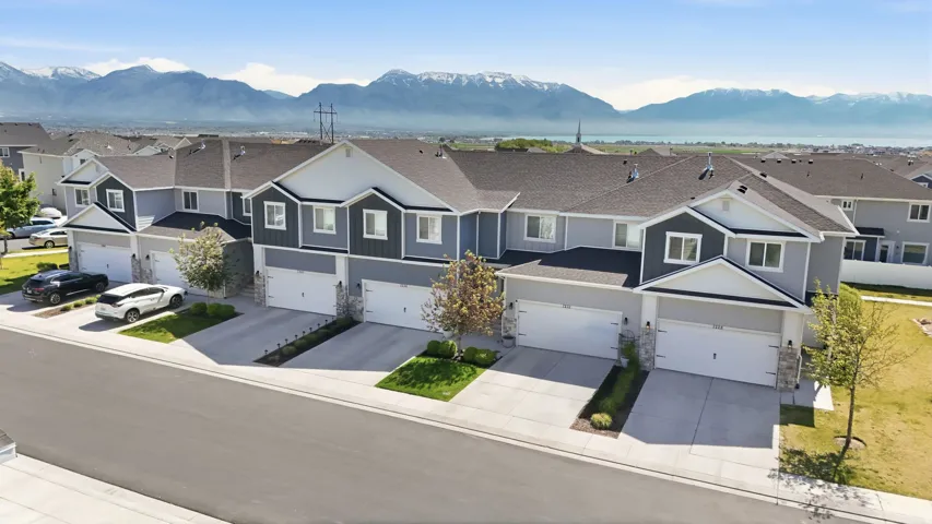 Modern townhome community featuring a consistent architectural style with varying color palettes