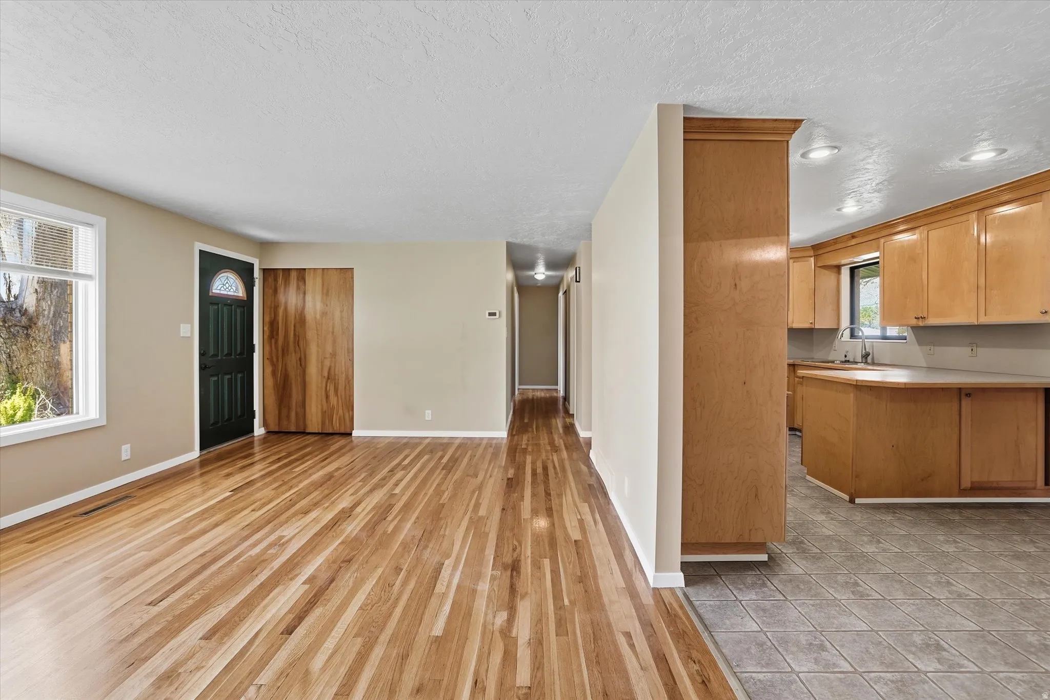 Hardwood-style flooring extends through the main living area