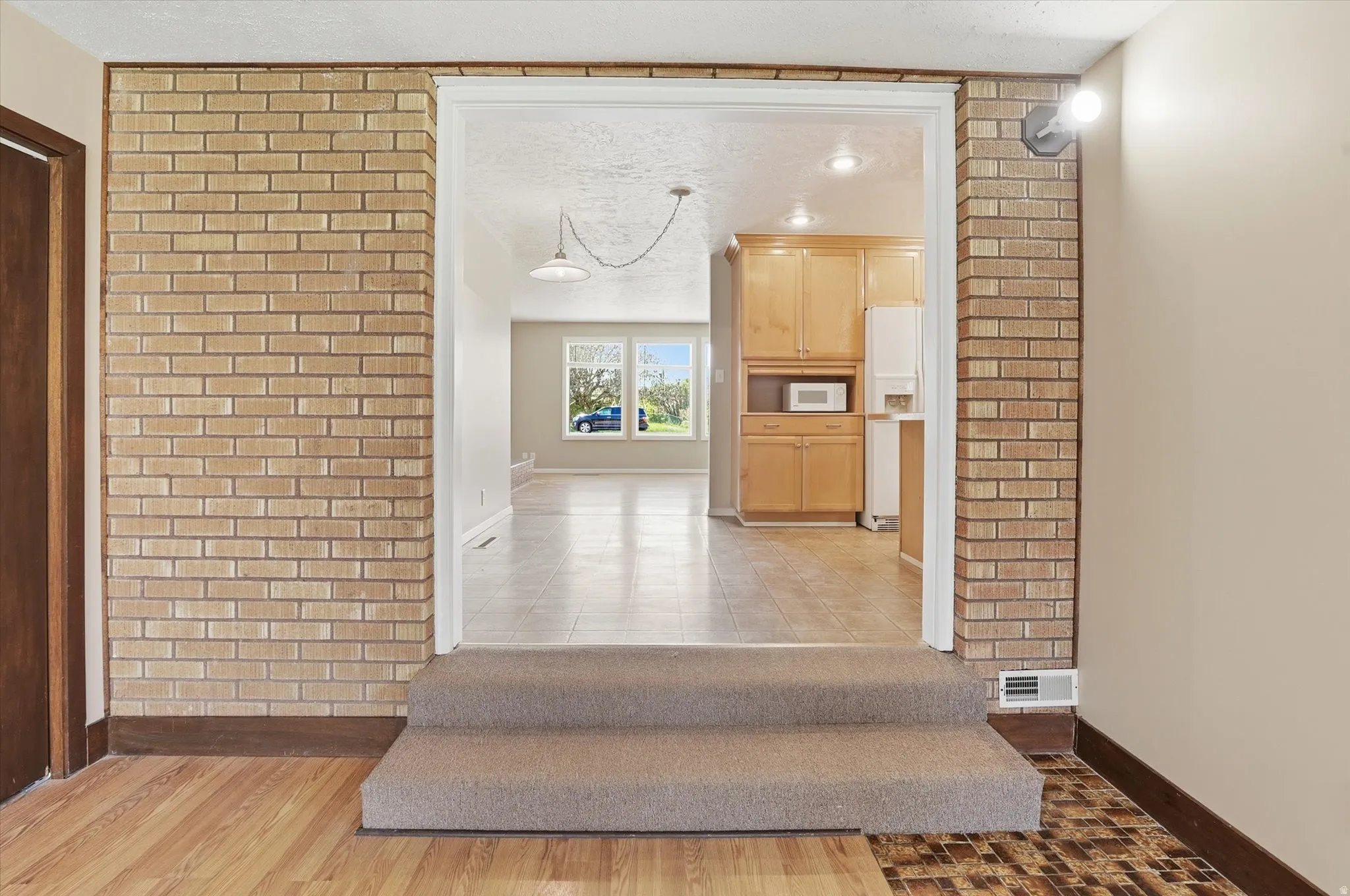 Interior brick accent wall with light brown brickwork