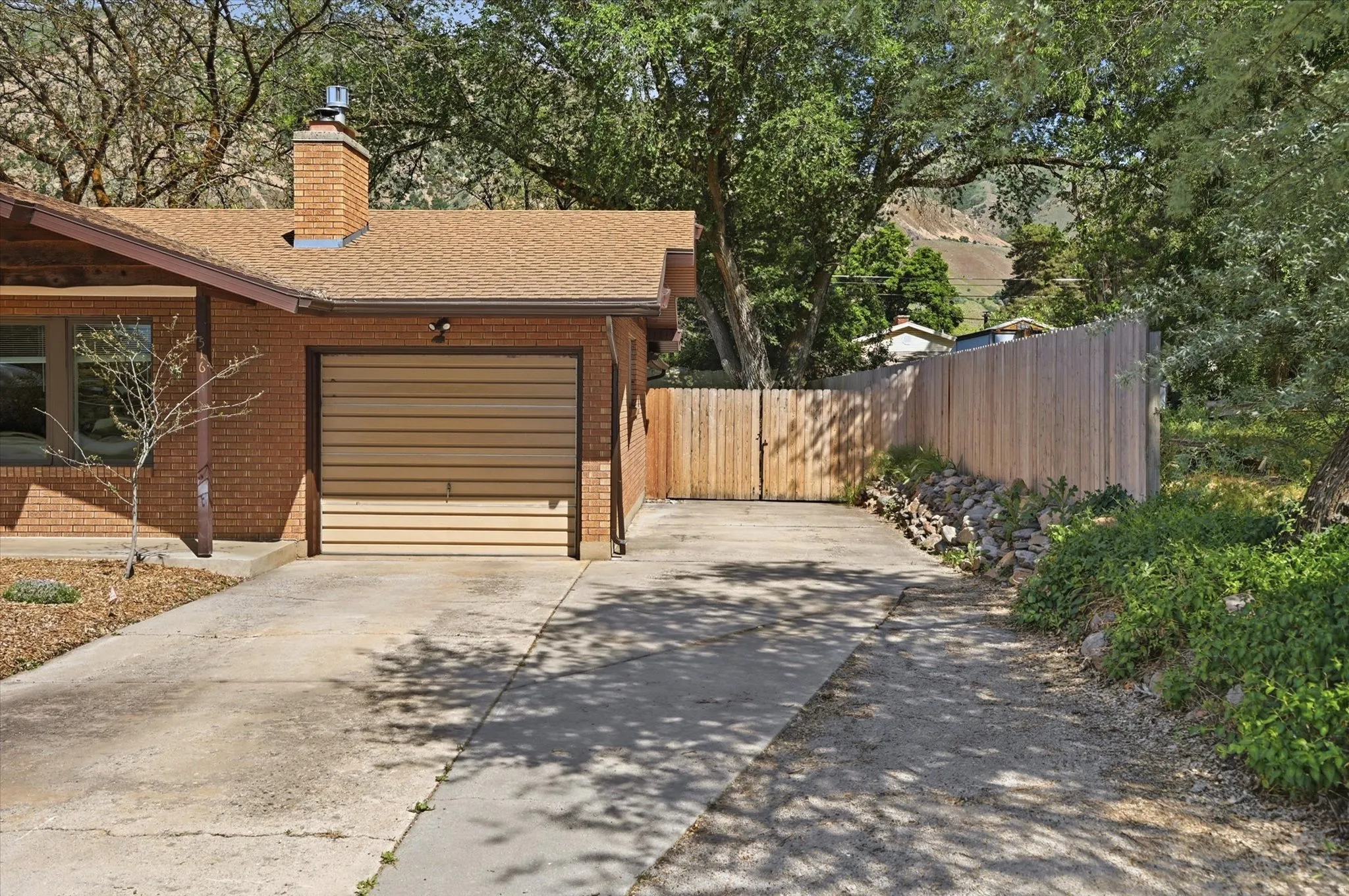 Brick exterior with an attached garage featuring a horizontal panel door