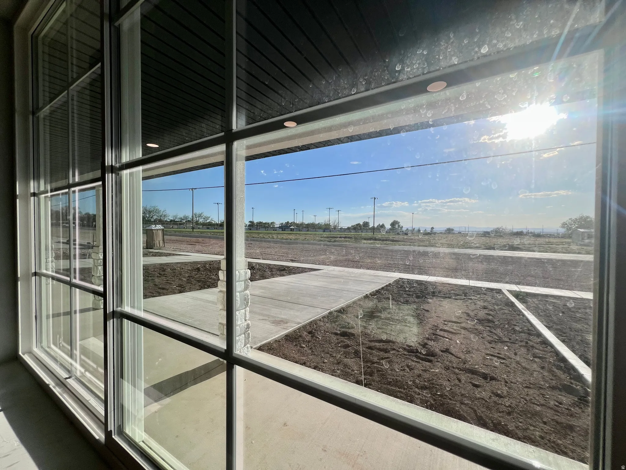Large multi-pane sliding glass door providing access to the exterior