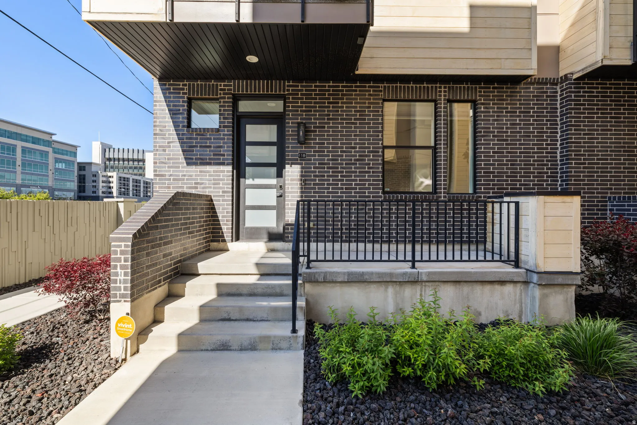 Doorway to property featuring brick siding