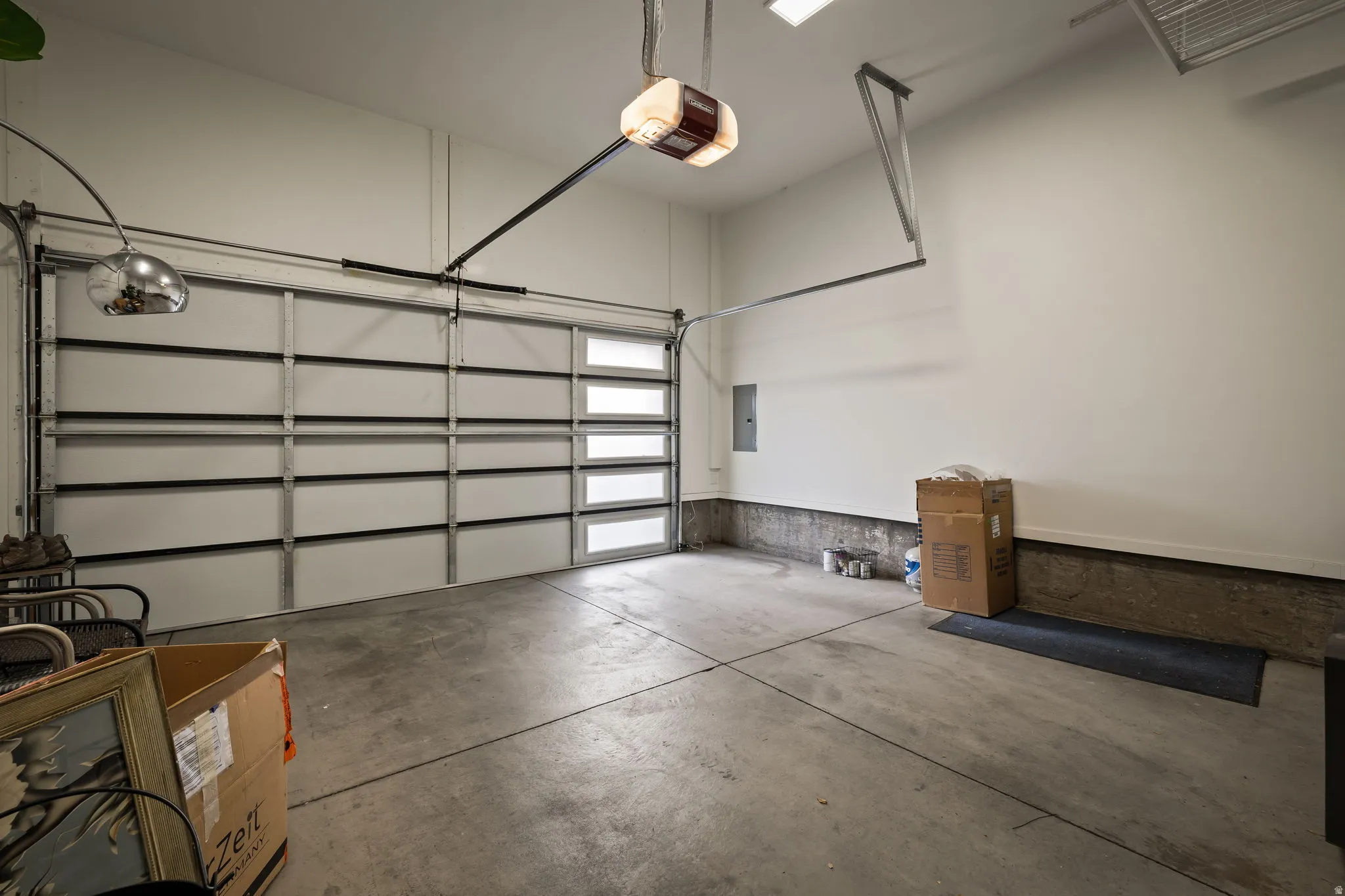 Garage with a garage door opener and electric panel