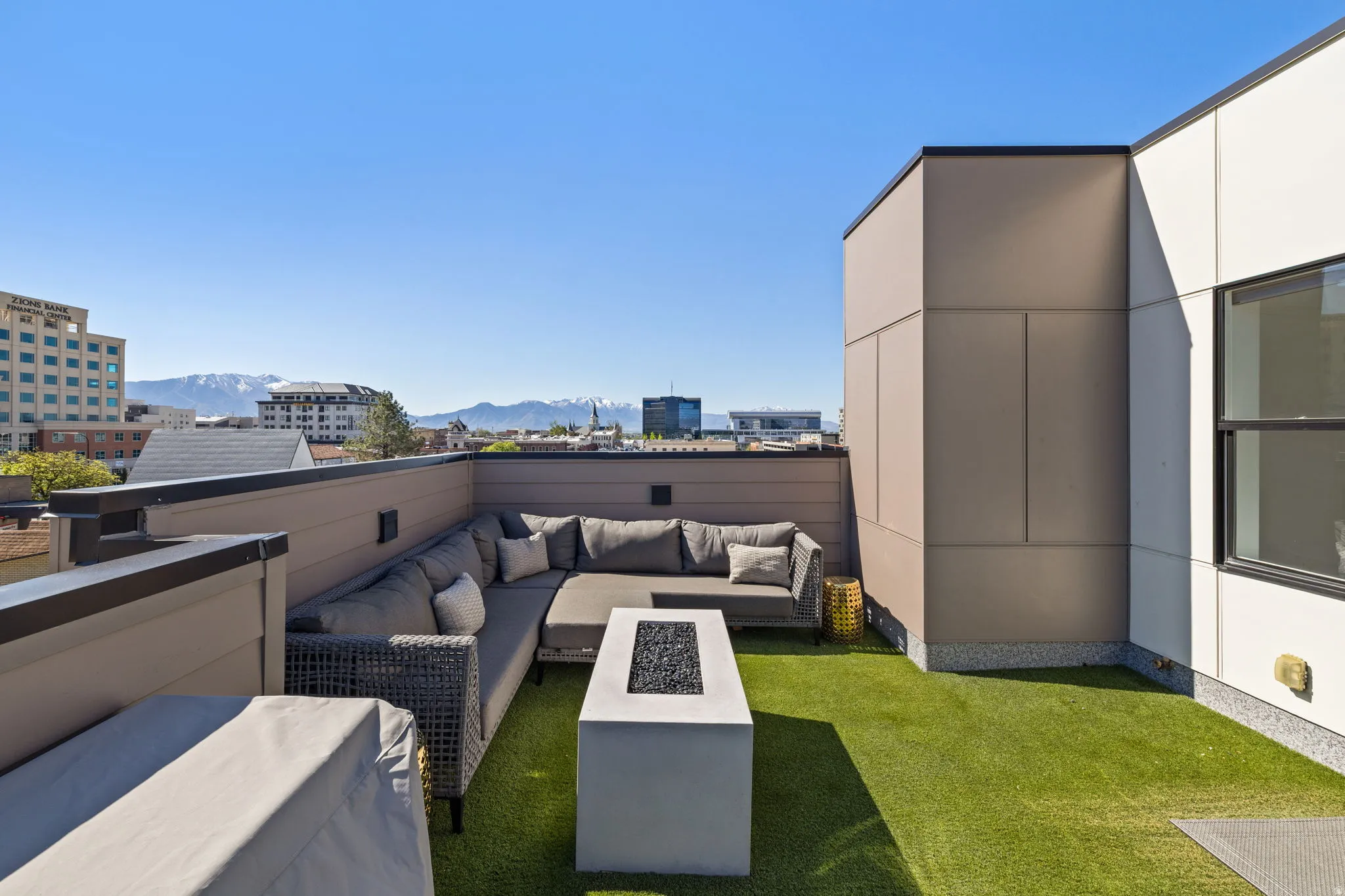 View of grassy yard featuring a patio area, outdoor lounge area, and a mountain view
