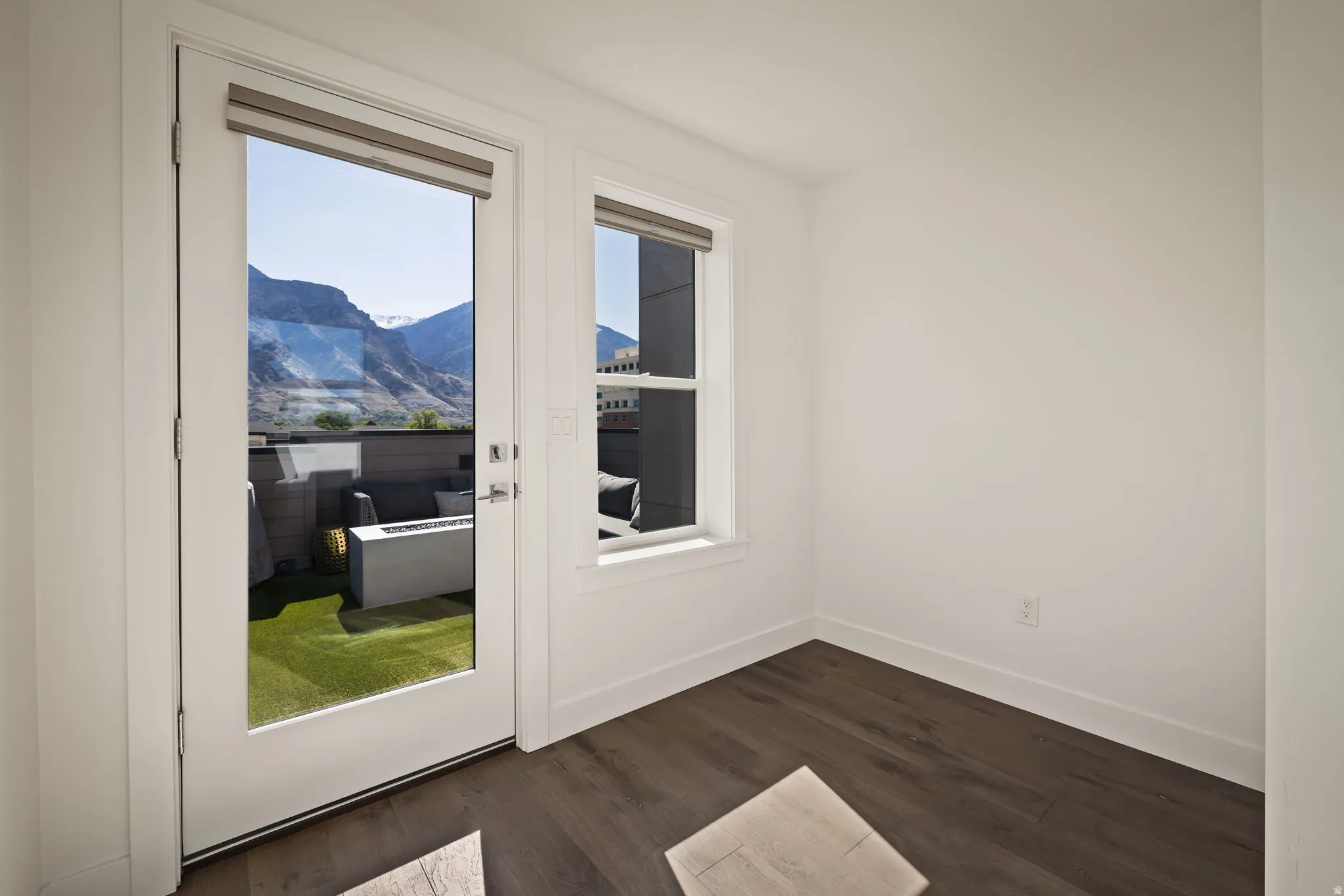 Doorway to outside featuring wood finished floors and a mountain view