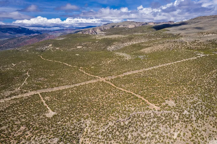 Expansive desert landscape featuring natural terrain and sparse vegetation