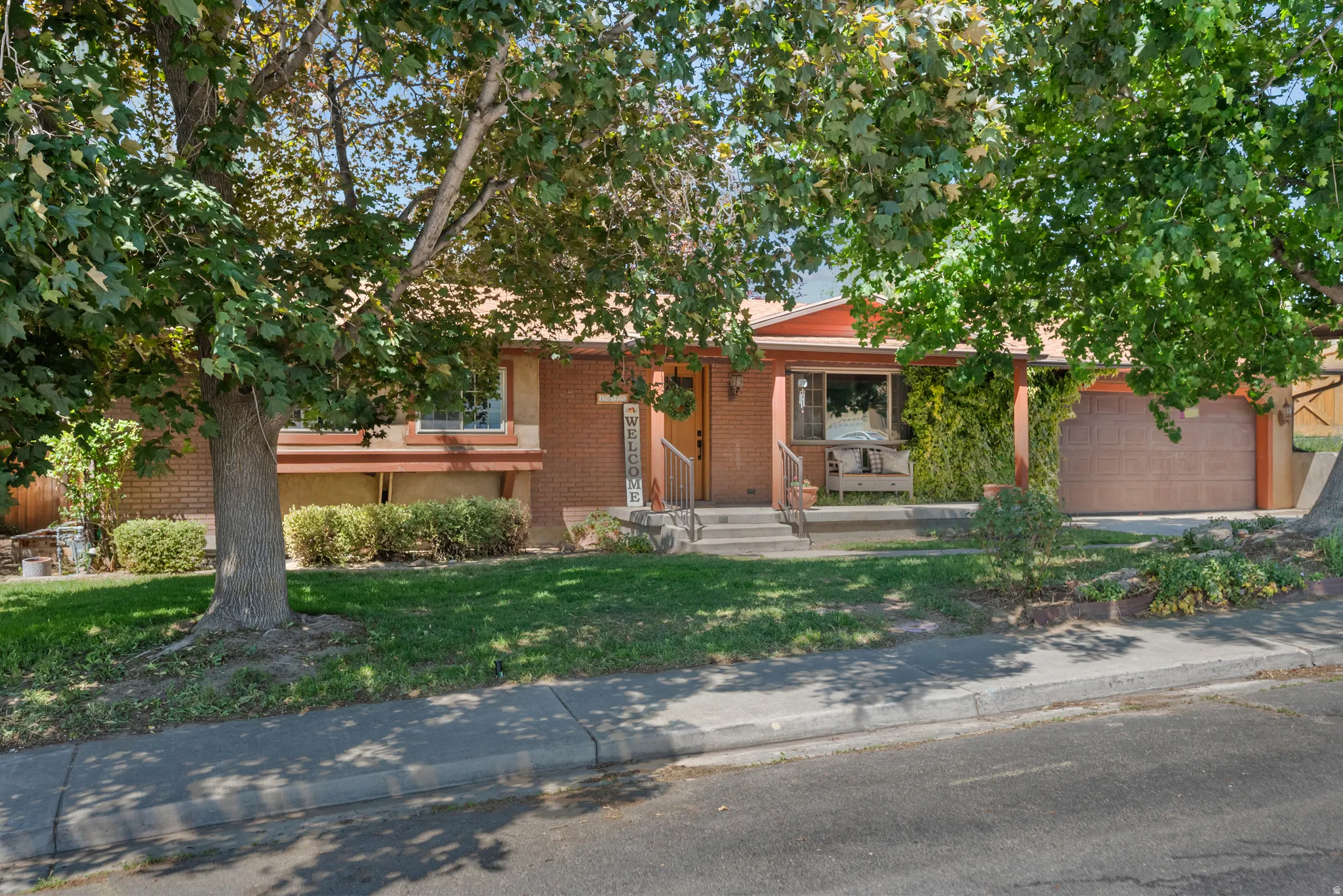 Brick exterior with a covered porch entry