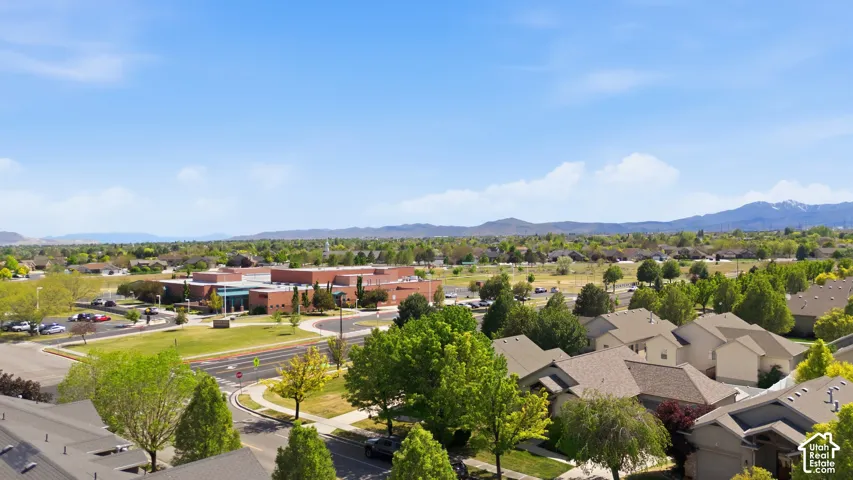 Expansive residential neighborhood featuring numerous mature trees and traditional-style homes with multi-pitch roofs