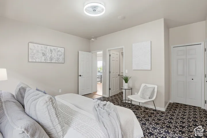 Owners suite, Light neutral wall paint throughout with a patterned carpet flooring