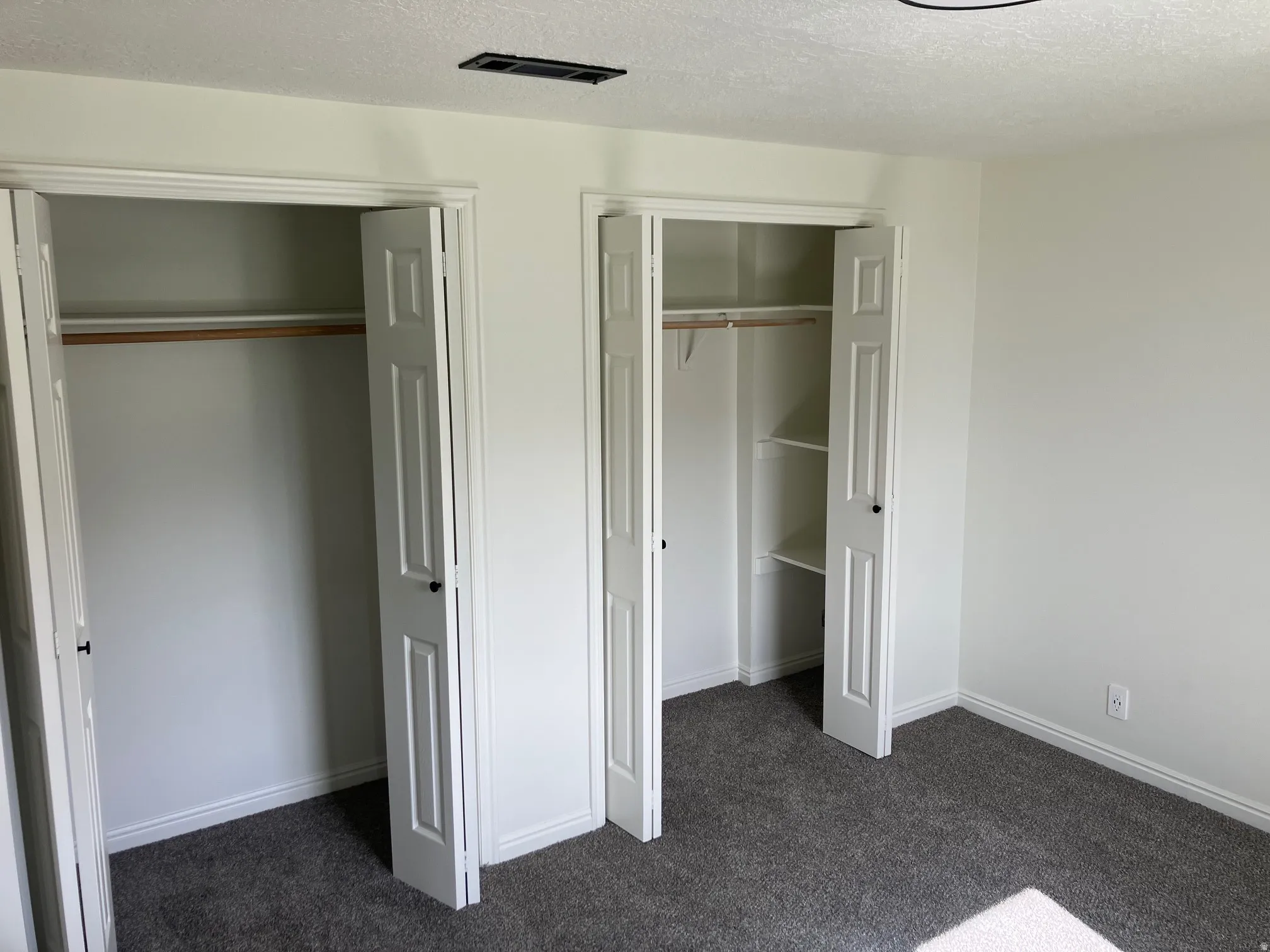 Double bi-fold closet doors with panel detailing