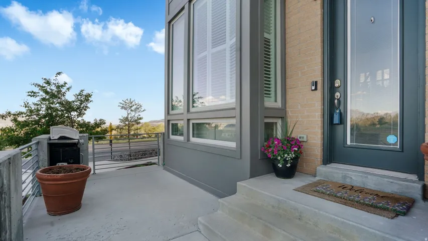 Exterior featuring a modern aesthetic with light brick siding and dark gray trim
